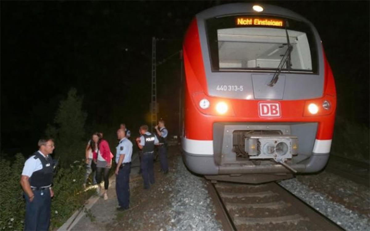 Four German train passengers suffer axe attack